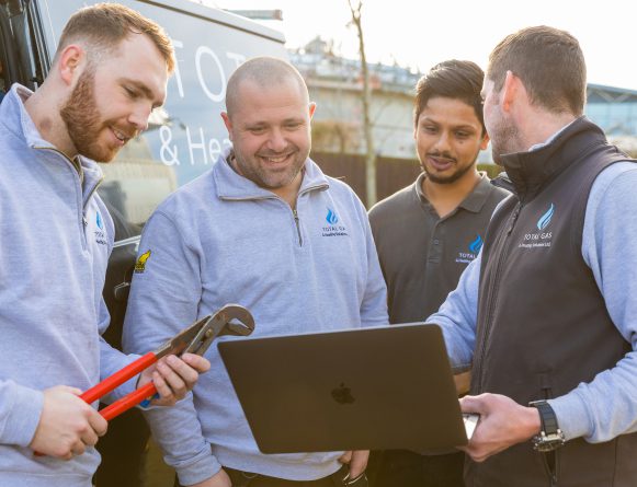 Gas and heating engineers talk with each other and decide the best course of action